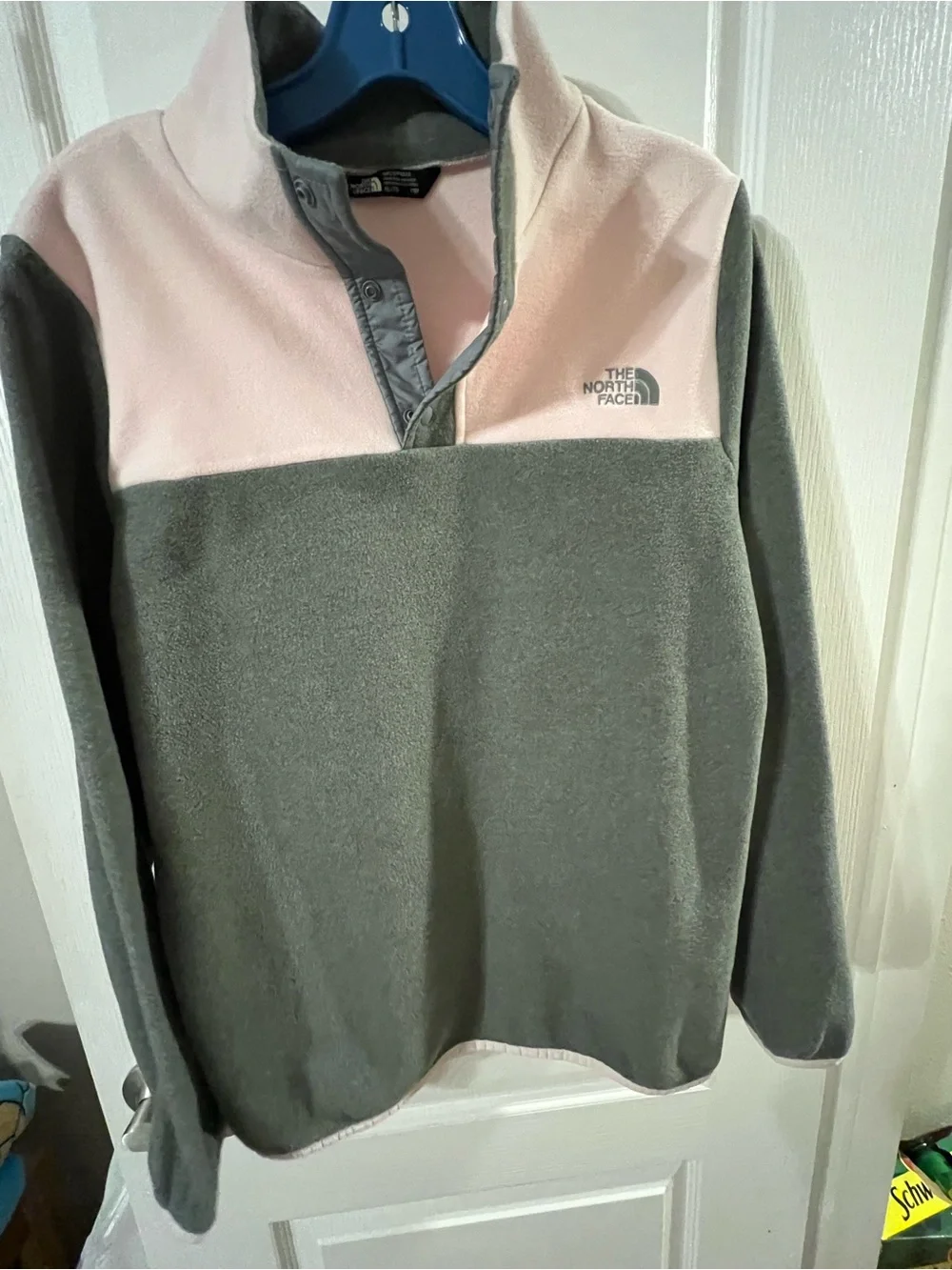 The North Face Girls' Fleece Pullover in grey and pink.